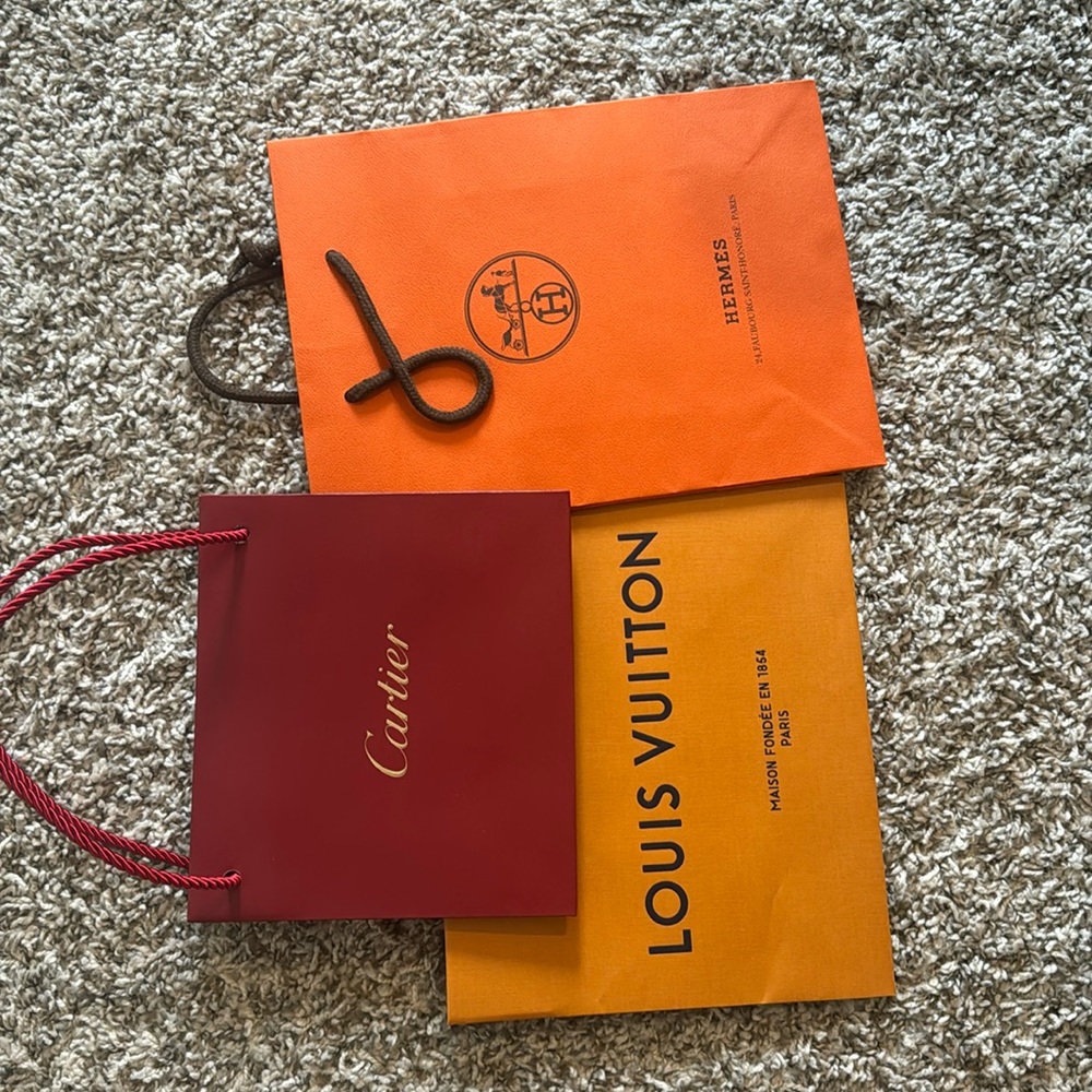 Authentic shopping bags, Louis Vuitton, Cartier, and Hermes.